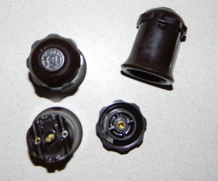 Paulding In - Line Screw Cap Sockets
These sockets are designed for attaching to heavy gauge (#16 to #10 gauge) twisted pair wiring and the pins pierces through the insulation to make the electrical connection. A lot of carnival and even holiday lighting is made from several of these sockets and a lot of twisted pair wires. Found these from the same yard sale where I came home with the Westy & GE 40 watt ceramic blue bulbs, The wiring that these were on was old cloth covered wires that were very brittle and that wire was discarded.
Keywords: Miscellaneous